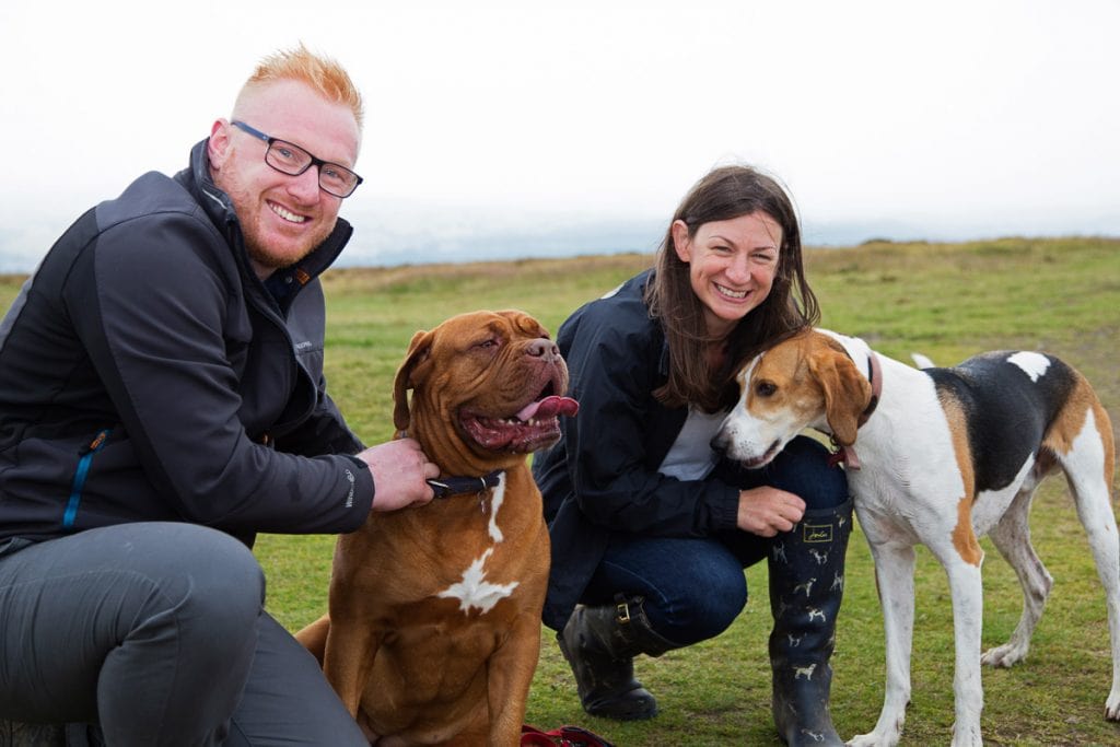 Anna and Ryan's Pre Wedding Shoot on Baildon Moor, capturing them with their dogs in a photo.