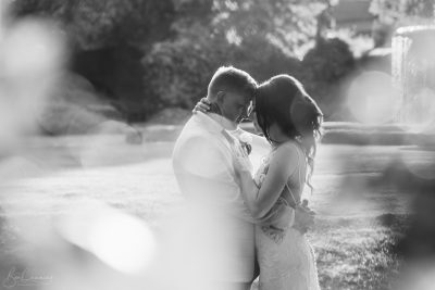 Bride and Groom in the setting sun at Oulton Hall