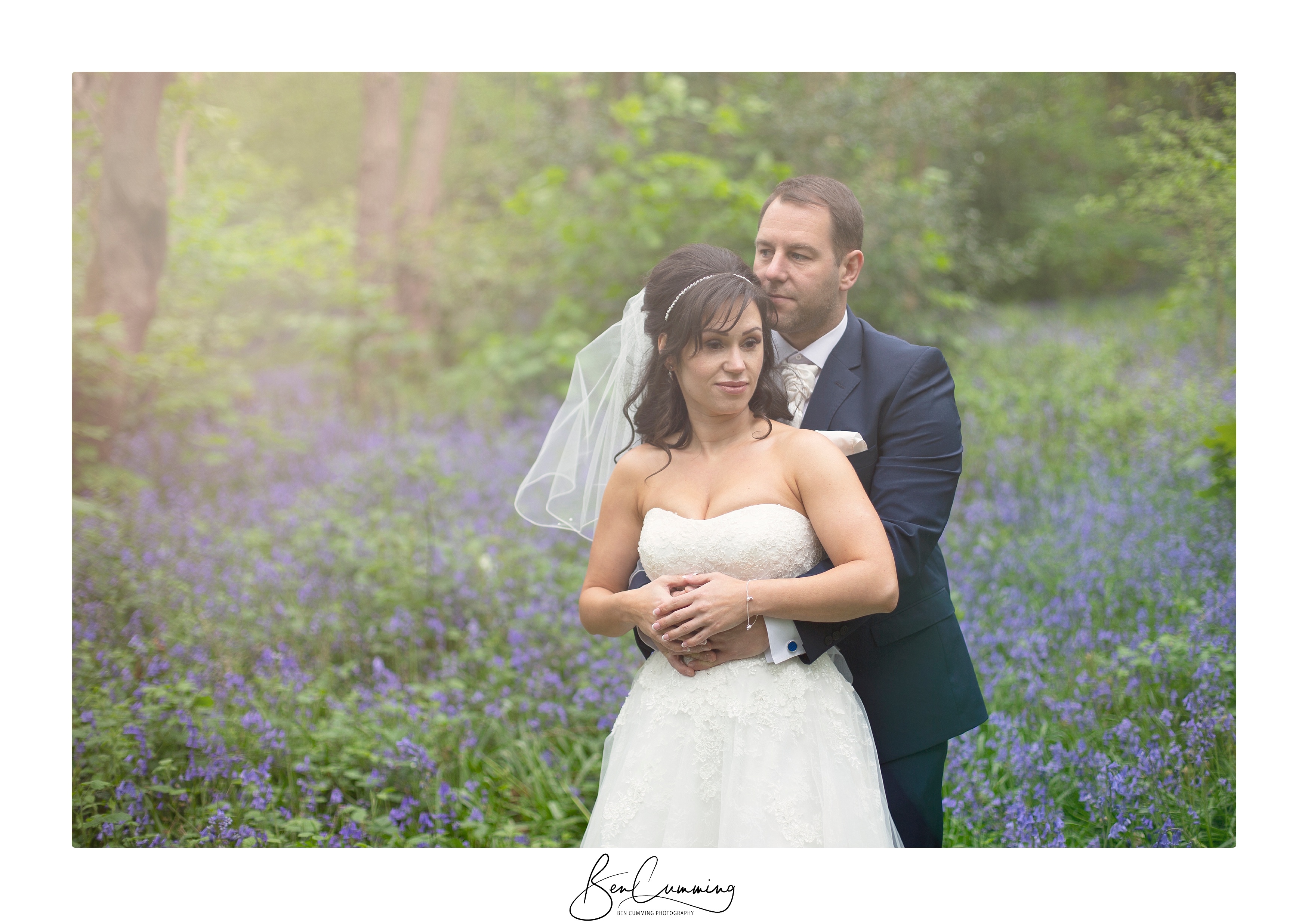 Sarah and Tim embracing in bluebells.