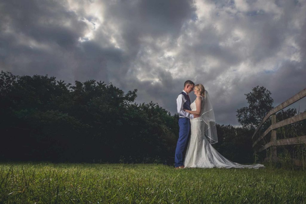 Bride and Groom with Dramatic Sky at the Gamekeepers Inn Threshfield