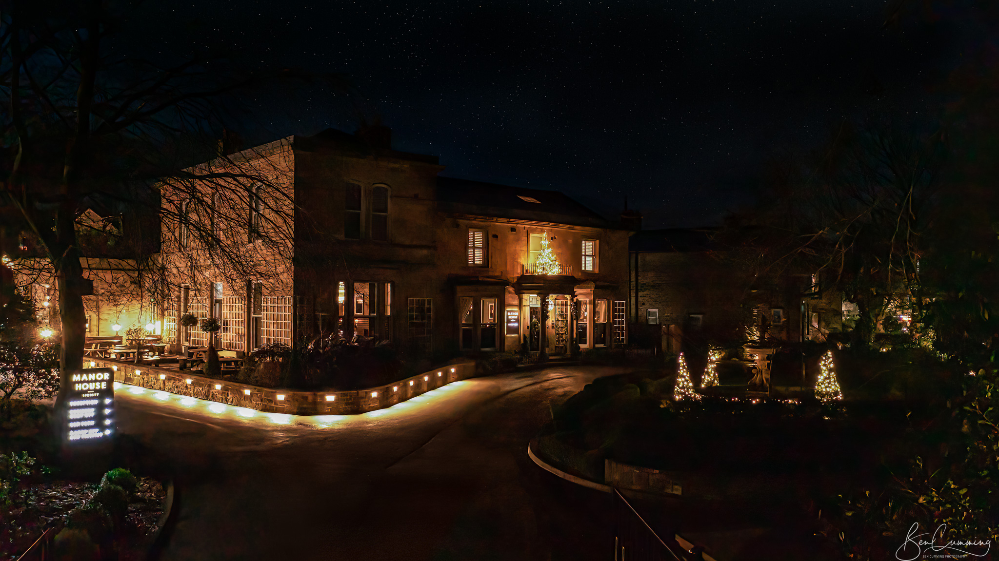 A drone Shot of the Manor House Lindley at night 