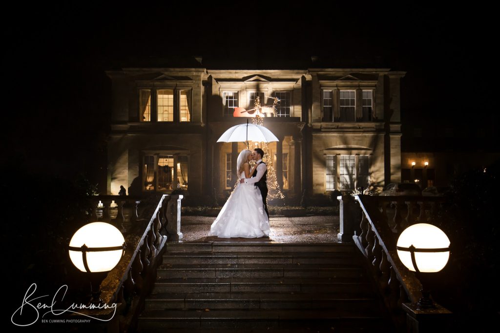 A night shot of the bride and groom at Oulton Hall