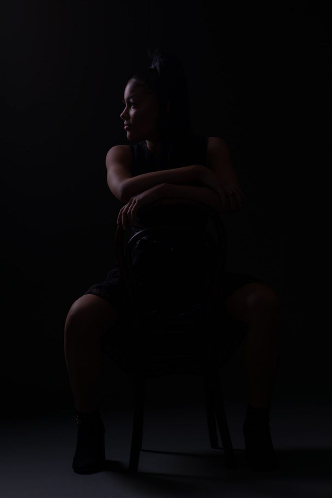 Silhouette Portrait of a girl on a chair