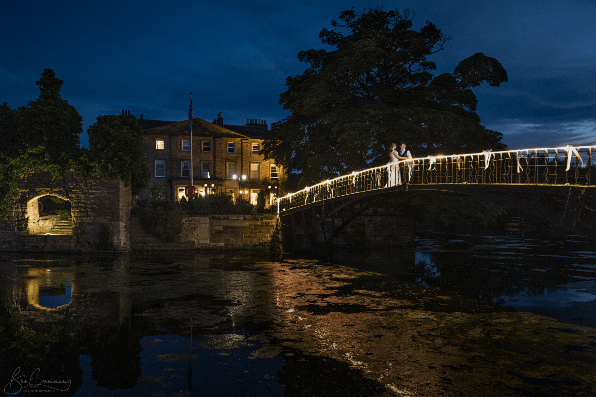 Bride and Groom at night on the bridge at Waterton Park