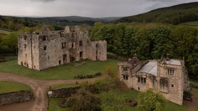 A drone photo of Barden Tower and The Priests House