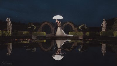 Bride & Groom at night with a wedding brolly at Allerton Castle