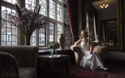Bride Poses alone at Goldsborough Hall in her Wedding Dress